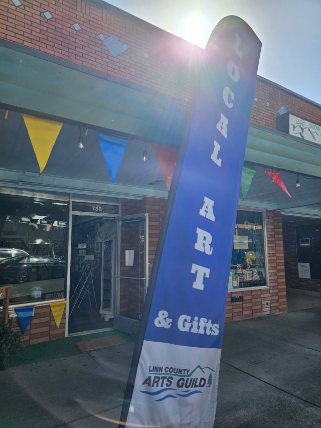 Blue local art flag outside of Linn County Arts Guild at 733 S. Main Street, downtown Lebanon, OR