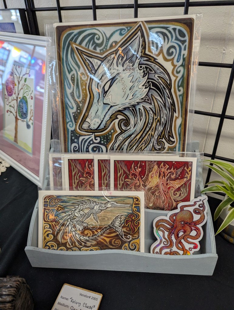 paintings in cellophane sleeves